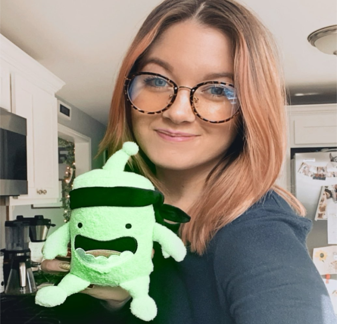 woman showing a mojo plush