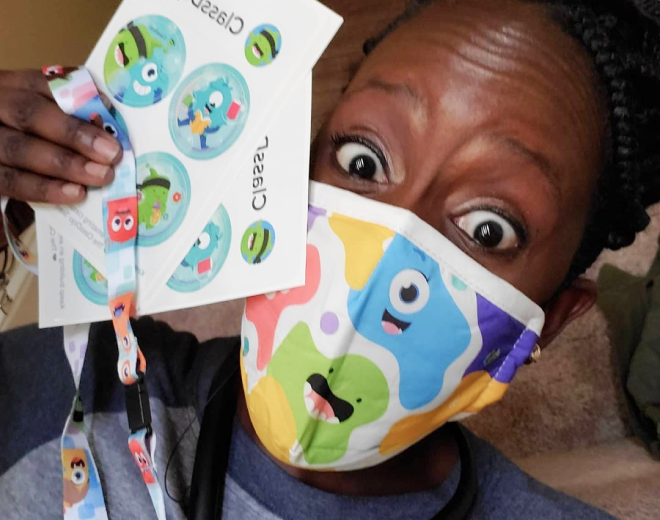 masked man showing classdojo stickers